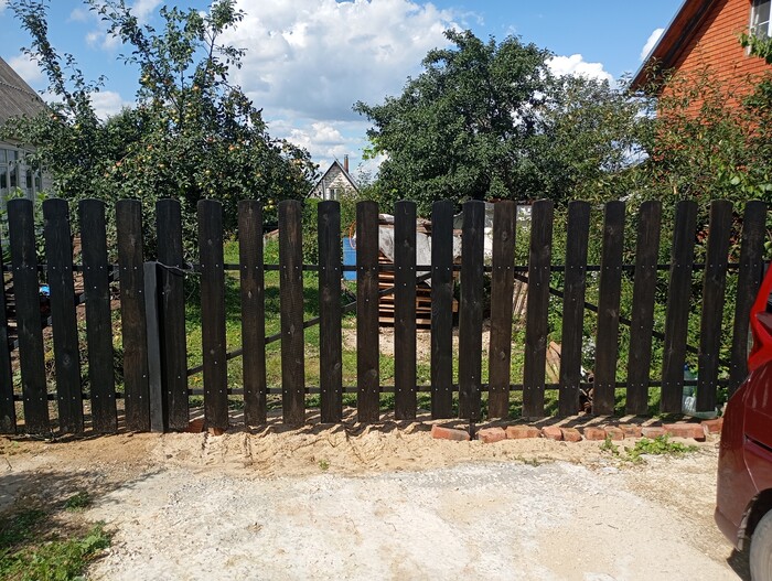 покраска забора отработкой масла